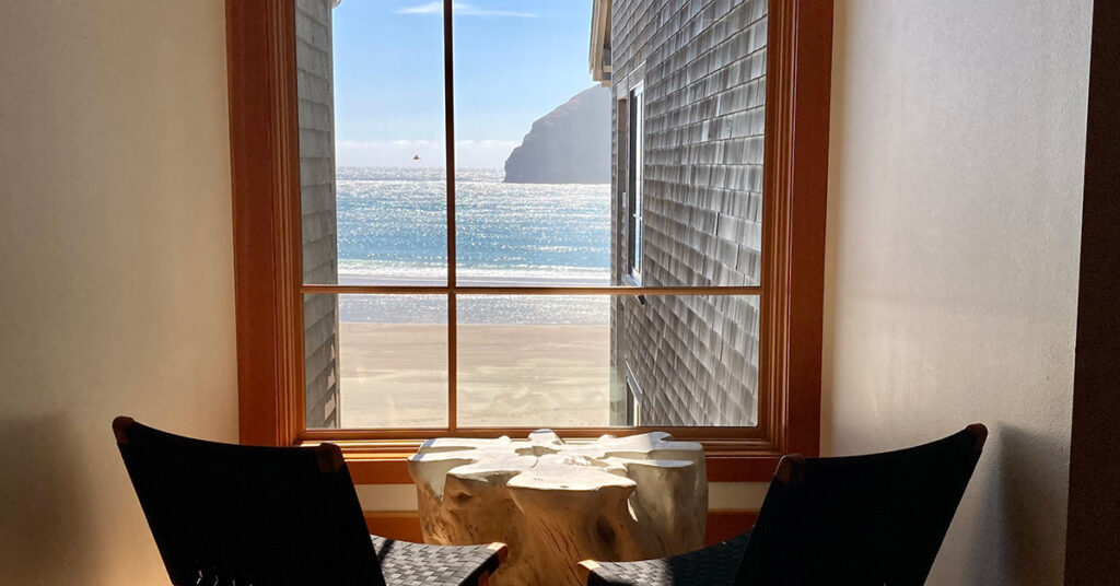 Interior corridor of Headlands Coastal Lodge in Pacific City, Oregon, with view of Haystack Rock - venues requiring Oregon Alcohol Service Permits